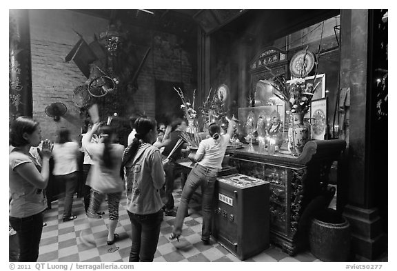 Women worshipping, Chua Ngoc Hoang pagoda, district 3. Ho Chi Minh City, Vietnam (black and white)