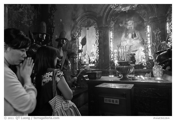 Women worshipping Thang Hoang, Phuoc Hai Tu pagoda, district 3. Ho Chi Minh City, Vietnam