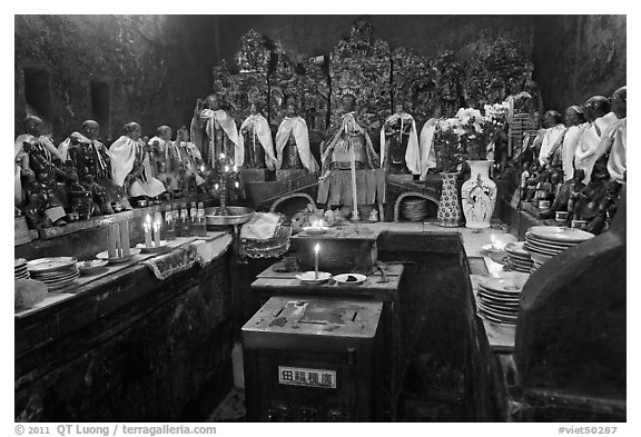 Room with figures of 12 women, each examplifying a human characteristic, Jade Emperor Pagoda, district 3. Ho Chi Minh City, Vietnam (black and white)