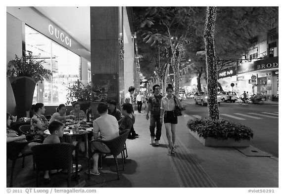 Street with luxury stores at night. Ho Chi Minh City, Vietnam