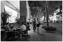 Street with luxury stores at night. Ho Chi Minh City, Vietnam (black and white)