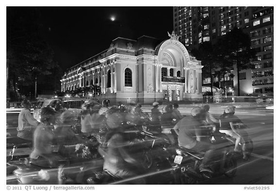 Motorcycles and Opera House at night. Ho Chi Minh City, Vietnam (black and white)