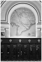 Phone booths and colonial-area map, Central Post Office. Ho Chi Minh City, Vietnam ( black and white)