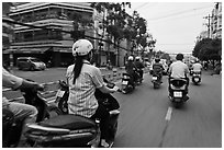 Motorcycle traffic seen from the street. Ho Chi Minh City, Vietnam (black and white)