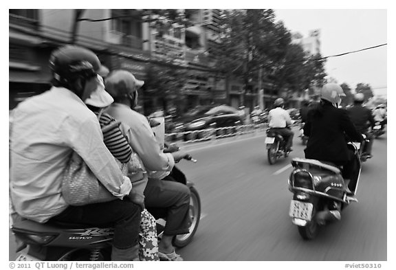 Motorcycle traffic seen from a motorcyle in motion. Ho Chi Minh City, Vietnam (black and white)