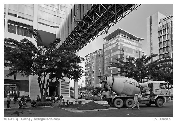 Asphalt truck and new urban area, Phu My Hung, district 7. Ho Chi Minh City, Vietnam