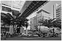 Asphalt truck and new urban area, Phu My Hung, district 7. Ho Chi Minh City, Vietnam (black and white)