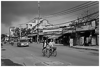 Street with moonson clouds, district 7. Ho Chi Minh City, Vietnam (black and white)