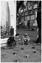 Men having breakfast on a sidewalk. Ho Chi Minh City, Vietnam ( black and white)