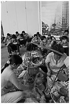 Food vendor preparing breakfast on the street. Ho Chi Minh City, Vietnam ( black and white)