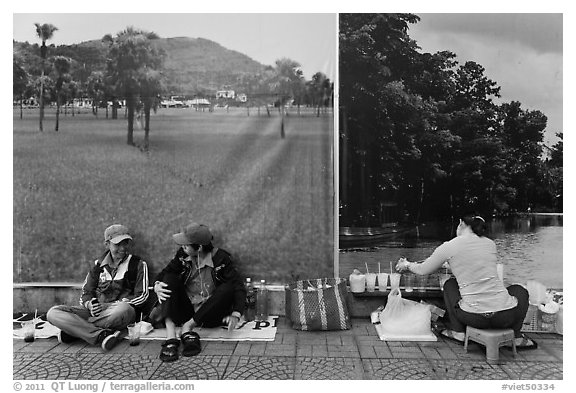 Students, food vendor, and landscape backdrops. Ho Chi Minh City, Vietnam