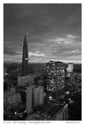 Bitexco Tower and city lights at sunset. Ho Chi Minh City, Vietnam