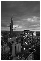 Bitexco Tower and city lights at sunset. Ho Chi Minh City, Vietnam (black and white)