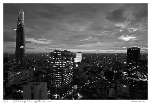 Bitexco Tower and city skyline at sunset. Ho Chi Minh City, Vietnam