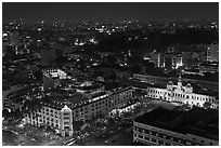 Peoples Committee building and Rex Hotel at night. Ho Chi Minh City, Vietnam ( black and white)