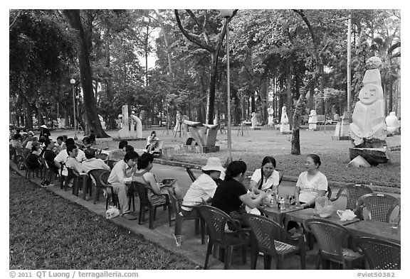 Outdoor refreshments served in front of sculpture garden, Cong Vien Van Hoa Park. Ho Chi Minh City, Vietnam (black and white)