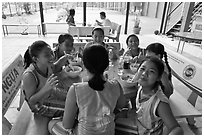 Girls athetics team eating, Cong Vien Van Hoa Park. Ho Chi Minh City, Vietnam ( black and white)