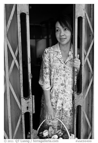 Teacher in doorway, Ho Chi Minh city. Vietnam (black and white)