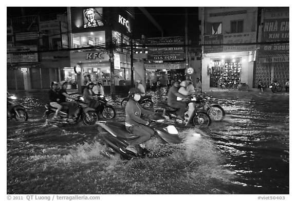 Street flooded by mooson rains at night. Ho Chi Minh City, Vietnam