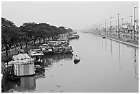 Cargo boats moored on Saigon Arroyau. Cholon, Ho Chi Minh City, Vietnam ( black and white)