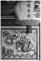 Lantern and ceramic dragon, Ha Chuong Hoi Quan Pagoda. Cholon, District 5, Ho Chi Minh City, Vietnam ( black and white)