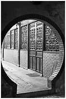 Circular door, Ha Chuong Hoi Quan Pagoda. Cholon, District 5, Ho Chi Minh City, Vietnam (black and white)