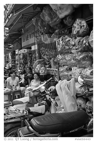 Store selling traditional dragon masks. Cholon, Ho Chi Minh City, Vietnam (black and white)
