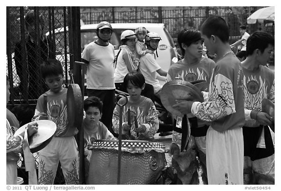 Dragon dance band made of children, Thien Hau Pagoda. Cholon, District 5, Ho Chi Minh City, Vietnam (black and white)