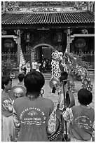 Drumners and dragon dancers in front of Thien Hau Pagoda, district 5. Cholon, District 5, Ho Chi Minh City, Vietnam (black and white)