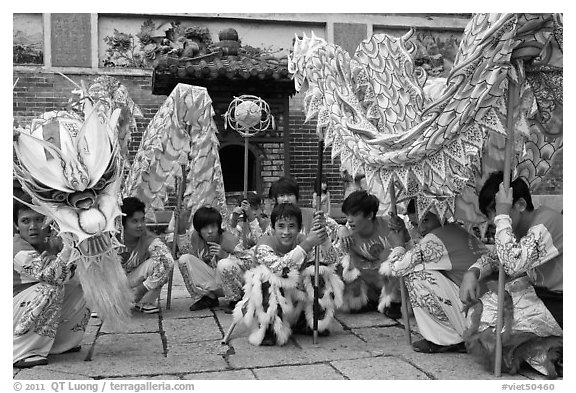 Dragon dancers at rest, Thien Hau Pagoda. Cholon, District 5, Ho Chi Minh City, Vietnam (black and white)