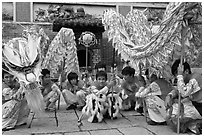 Dragon dancers at rest, Thien Hau Pagoda. Cholon, District 5, Ho Chi Minh City, Vietnam ( black and white)