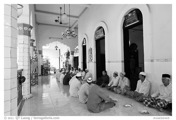 Men sharing food in gallery, Cholon Mosque. Cholon, District 5, Ho Chi Minh City, Vietnam (black and white)