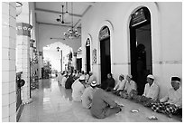 Men sharing food in gallery, Cholon Mosque. Cholon, District 5, Ho Chi Minh City, Vietnam (black and white)