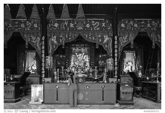 Woman at altar, Tam Son Hoi Quan Pagoda. Cholon, District 5, Ho Chi Minh City, Vietnam (black and white)