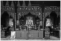 Woman at altar, Tam Son Hoi Quan Pagoda. Cholon, District 5, Ho Chi Minh City, Vietnam ( black and white)