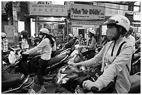 Commuters on motorcyles in stopped traffic. Ho Chi Minh City, Vietnam (black and white)