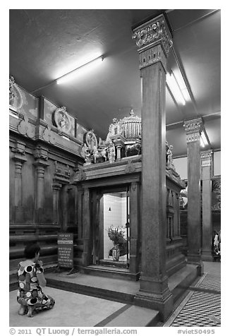 Worshipping inside Mariamman Hindu Temple. Ho Chi Minh City, Vietnam (black and white)