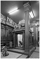 Worshipping inside Mariamman Hindu Temple. Ho Chi Minh City, Vietnam (black and white)