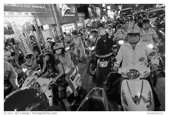 Street filled with motorcycles at rush hour. Ho Chi Minh City, Vietnam (black and white)