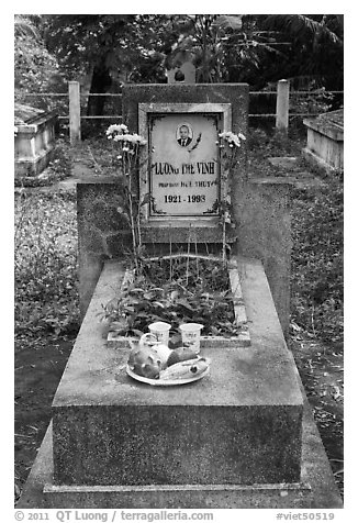 Tomb with fruit and refreshments offering. Ben Tre, Vietnam (black and white)