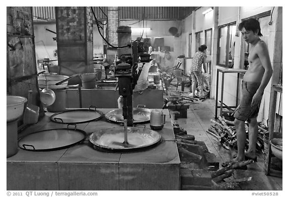 Pots in cococut candy factory. Ben Tre, Vietnam (black and white)