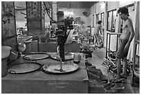 Pots in cococut candy factory. Ben Tre, Vietnam ( black and white)