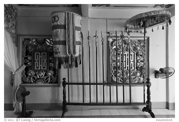 Rack with lamp, unbrella, lances, Saigon Caodai temple, district 5. Ho Chi Minh City, Vietnam (black and white)