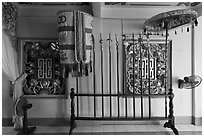 Rack with lamp, unbrella, lances, Saigon Caodai temple, district 5. Ho Chi Minh City, Vietnam (black and white)