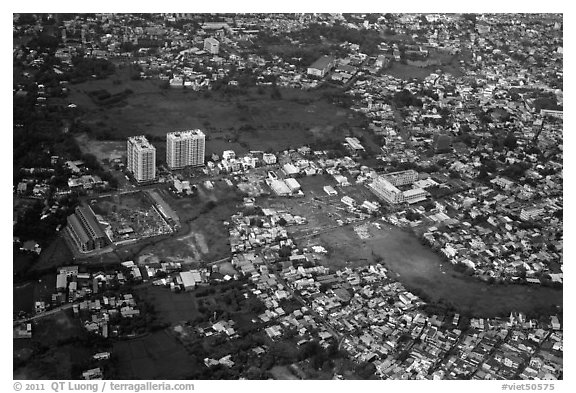 Aerial view of houses and high-rises on the outskirts of the city. Ho Chi Minh City, Vietnam (black and white)