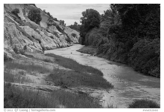 Fairy Stream passing through eroded sand and sandstone landscape. Mui Ne, Vietnam (black and white)