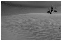 Typical vietnamese figure on Mui Ne dunes. Mui Ne, Vietnam (black and white)