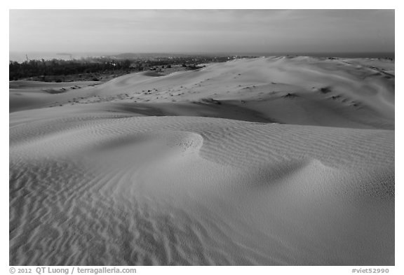 Mui Ne sand dunes, town in the distance. Mui Ne, Vietnam