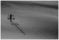 Shadows of woman on dune field. Mui Ne, Vietnam (black and white)