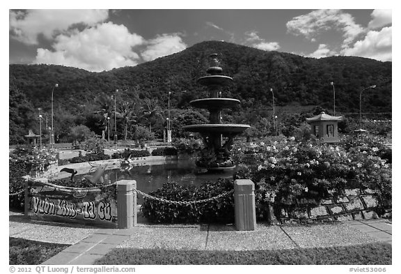 Fountain and forested peak. Ta Cu Mountain, Vietnam (black and white)